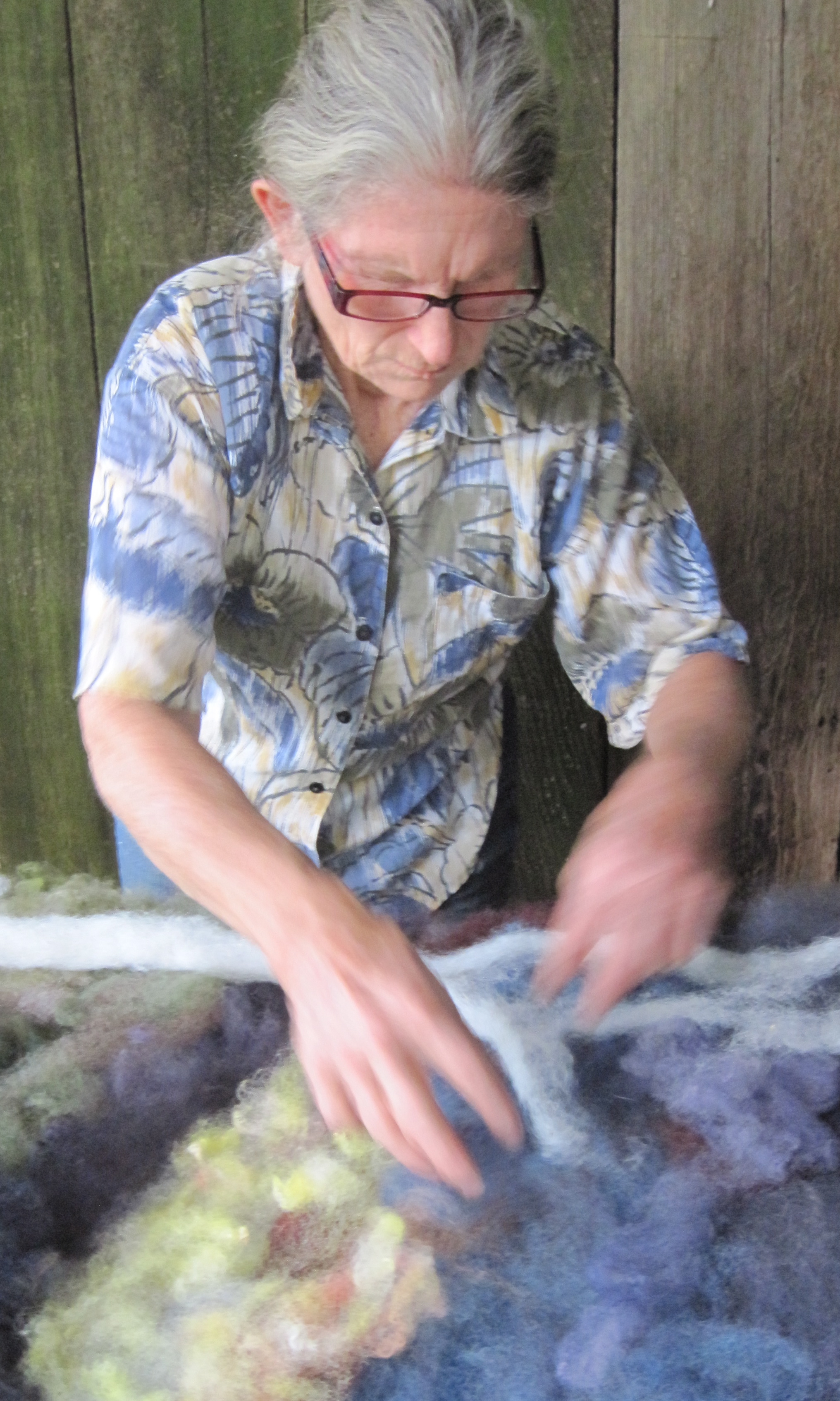 Joanne Slissman laying out colored wool