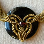 closeup of necklace medallion