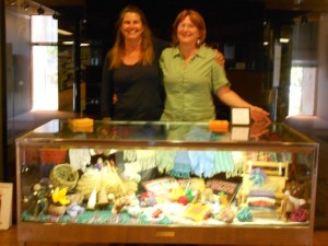 Setting up Fiber Arts display at the Library