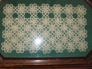 Family Heirlooms. A crocheted panel finding new purpose on a tray under glass.