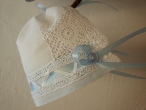 Handkerchiefs fashioned into baby bonnets by --Caspery