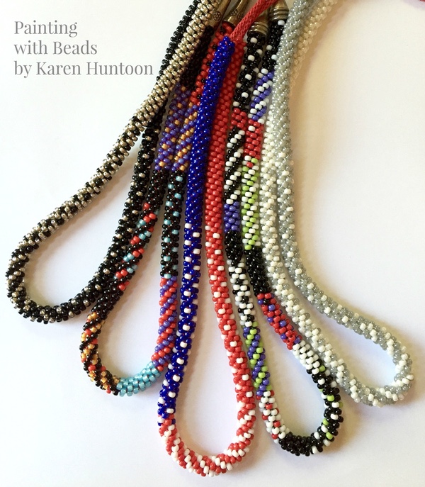 Multicolor strands of beaded kumihimo braids