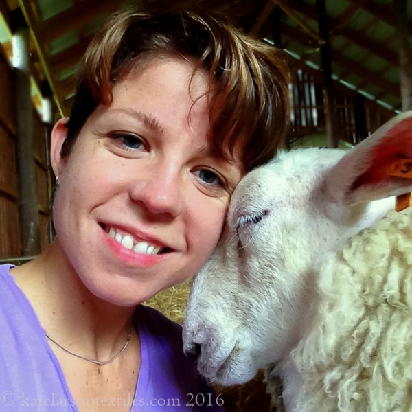 Photo of Kate Larson with a sheep