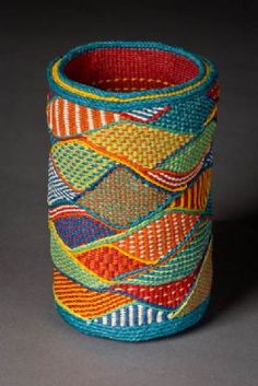 Cylindrical basket with tapestry-like wavy blocks of color