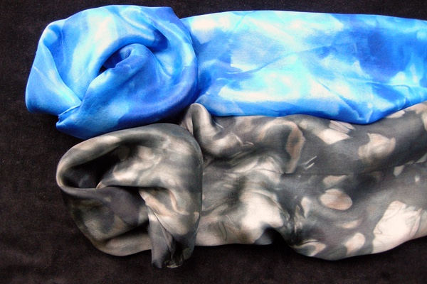 Silk scarves dyed in shades of color, one blues and one grays