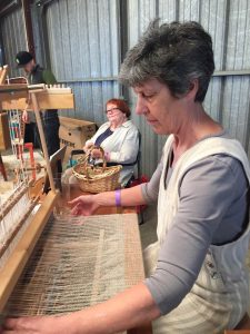 Sandy Fisher weaving and Jane Burke spinning flax at the Nut Festival