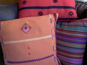 Jolom Maya pillows ornamented with ancient Maya sapo (frog) and star symbols